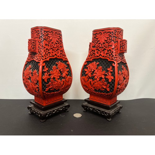 15 - Pair of Chinese red lacquer vases on stands.

This lot is available for in-house shipping