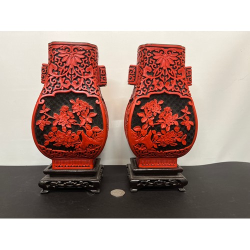 15 - Pair of Chinese red lacquer vases on stands.

This lot is available for in-house shipping