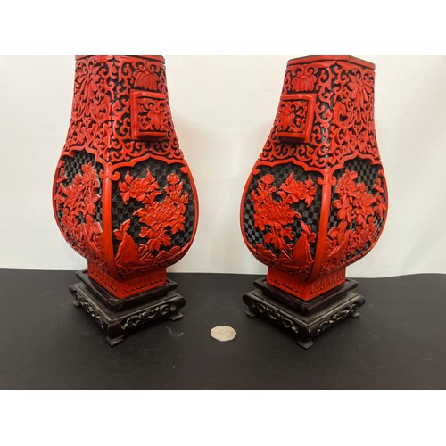 15 - Pair of Chinese red lacquer vases on stands.

This lot is available for in-house shipping