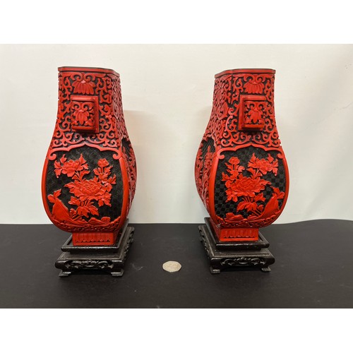 15 - Pair of Chinese red lacquer vases on stands.

This lot is available for in-house shipping