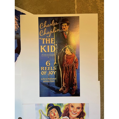 341 - Film posters, six quality prints of iconic movie posters, Singing in The Rain The Yellow Brick Road,... 