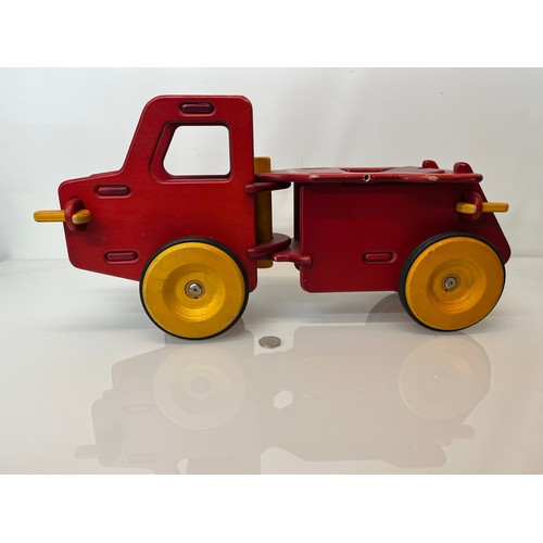 37 - Childs wooden ride on toy truck 23 inches long.

This lot is available for in-house shipping