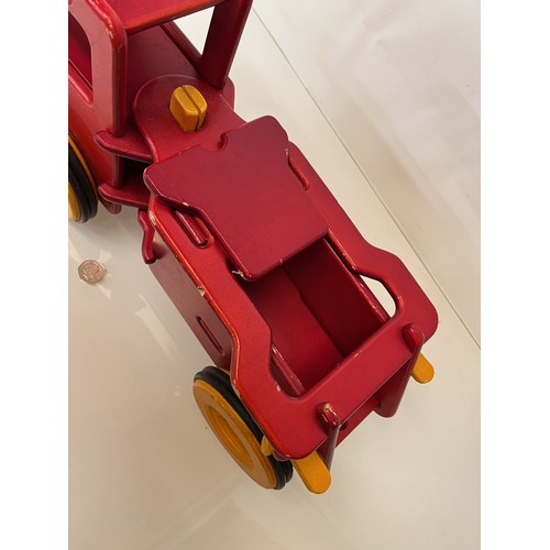 37 - Childs wooden ride on toy truck 23 inches long.

This lot is available for in-house shipping