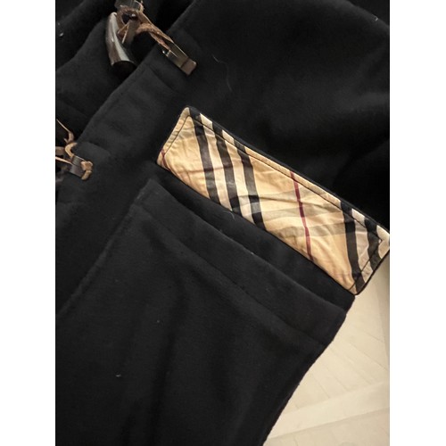 104 - Clothing, a branded Burberry children’s duffel coat.

This lot is available for in-house shipping