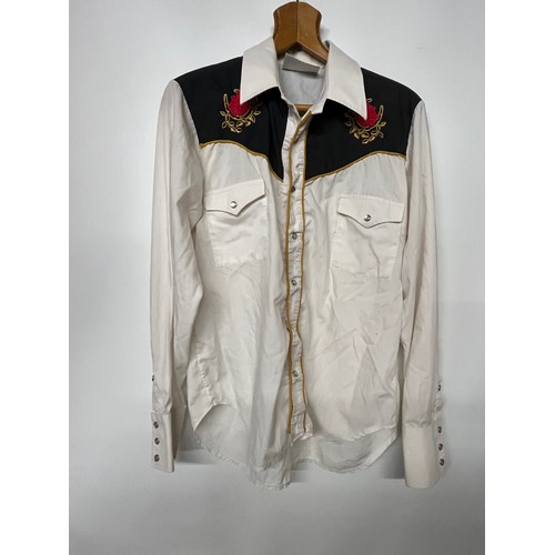 105 - Clothing, three Country Music, Western shirts, two with embroidered panels.

This lot is available f... 