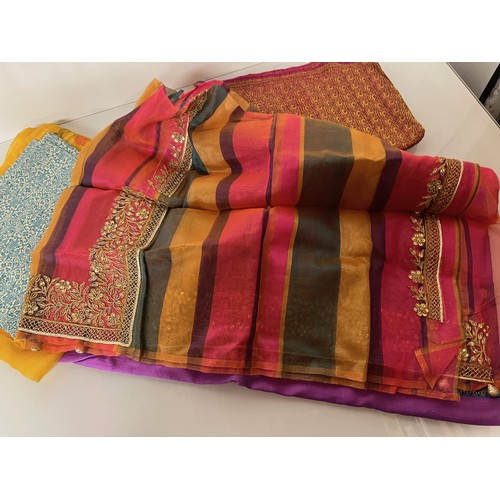 106 - Textiles, a collection of Indian fabrics.

This lot is available for in-house shipping