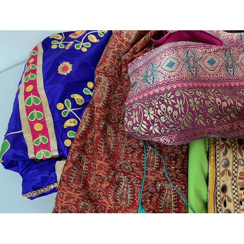 107 - Clothing, a collection of Indian skirts, coats etc.

This lot is available for in-house shipping