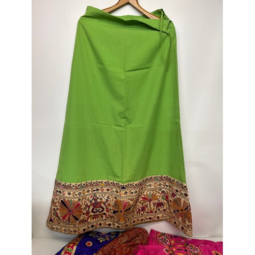 107 - Clothing, a collection of Indian skirts, coats etc.

This lot is available for in-house shipping