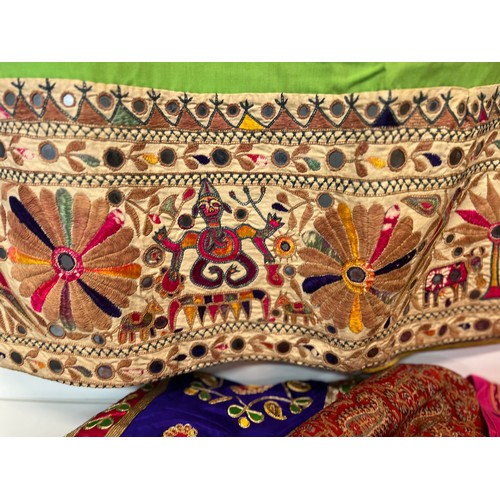 107 - Clothing, a collection of Indian skirts, coats etc.

This lot is available for in-house shipping