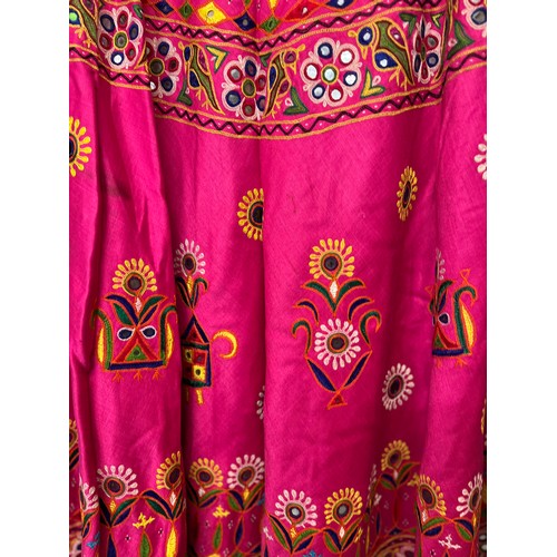 107 - Clothing, a collection of Indian skirts, coats etc.

This lot is available for in-house shipping