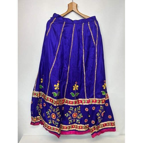 107 - Clothing, a collection of Indian skirts, coats etc.

This lot is available for in-house shipping