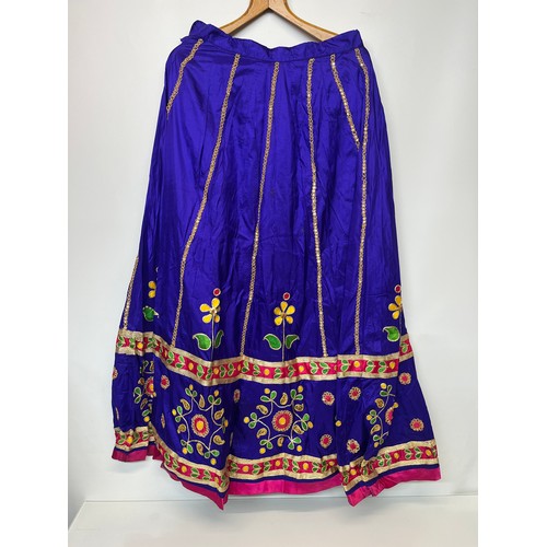 107 - Clothing, a collection of Indian skirts, coats etc.

This lot is available for in-house shipping