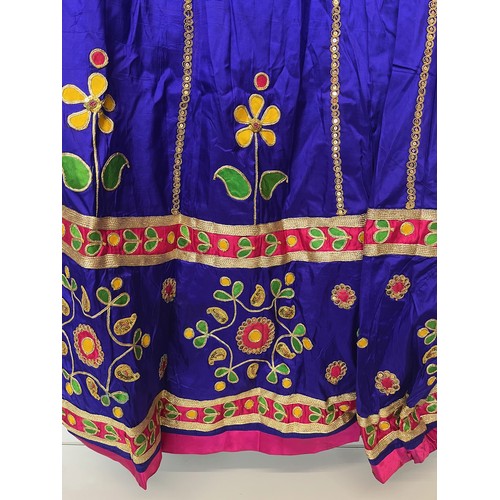 107 - Clothing, a collection of Indian skirts, coats etc.

This lot is available for in-house shipping