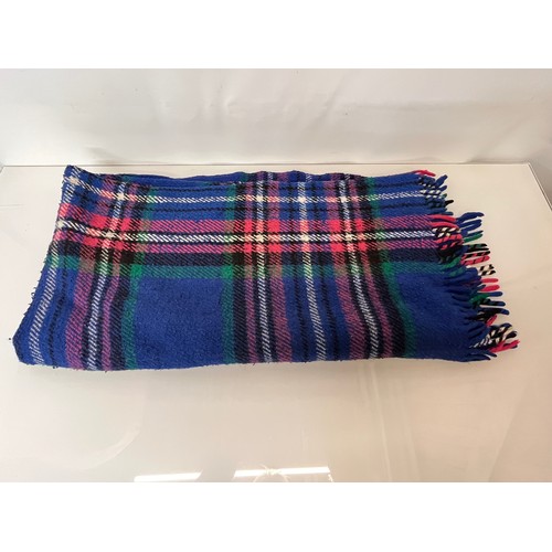 113 - Three woollen blankets in a variety of tartan colours.

This lot is available for in-house shipping