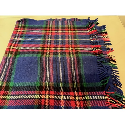 113 - Three woollen blankets in a variety of tartan colours.

This lot is available for in-house shipping