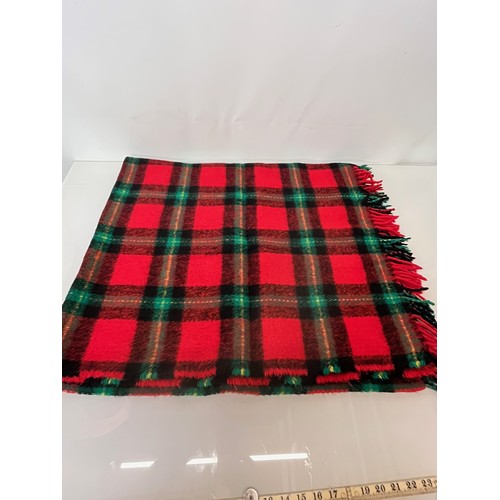 113 - Three woollen blankets in a variety of tartan colours.

This lot is available for in-house shipping