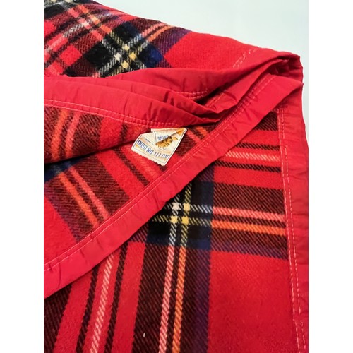 113 - Three woollen blankets in a variety of tartan colours.

This lot is available for in-house shipping