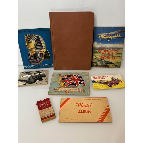 117 - Ephemera, cigarette cards and trade cards, a collection in seven albums and a packet as shown.

This... 