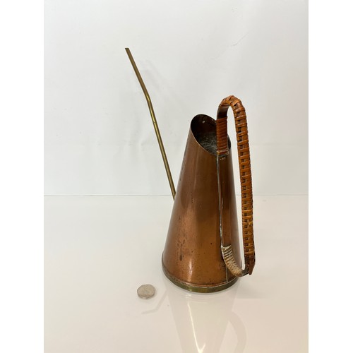 125 - Copper watering can.

This lot is available for in-house shipping