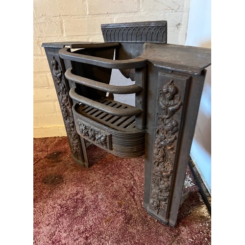 194 - Architectural salvage, decorated cast iron fire front with a raised hearth section. 22 inches wide x... 