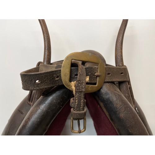 212 - Equestrian farming equipment, a horse collar with brass and wrought iron fittings.

This lot is avai... 