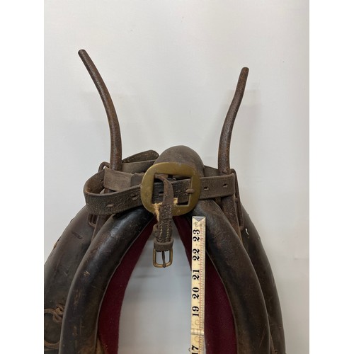 212 - Equestrian farming equipment, a horse collar with brass and wrought iron fittings.

This lot is avai... 