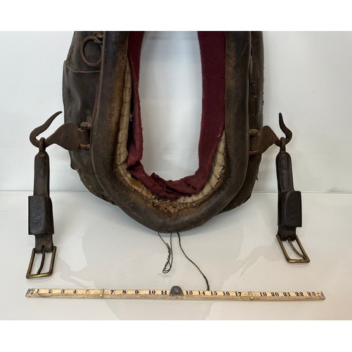 212 - Equestrian farming equipment, a horse collar with brass and wrought iron fittings.

This lot is avai... 