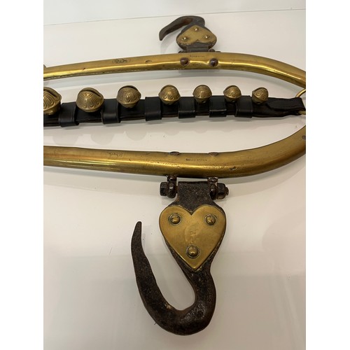 213 - Equestrian farming equipment, a horse hames with brass and wrought iron fittings.

This lot is avail... 