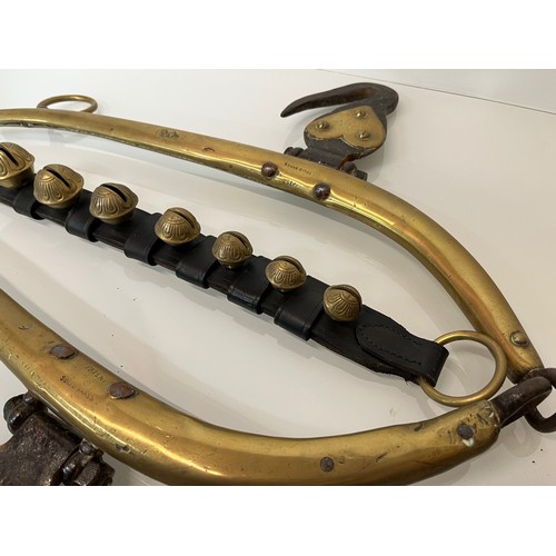 213 - Equestrian farming equipment, a horse hames with brass and wrought iron fittings.

This lot is avail... 