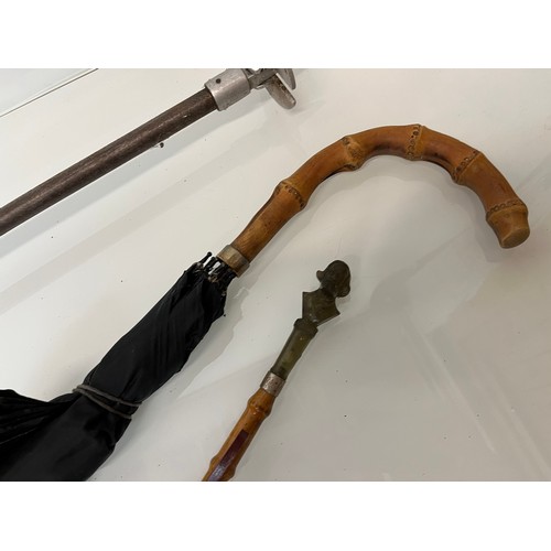 214 - Shooting stick with folding seat an umbrella and a shoe horn.

This lot is available for in-house sh... 