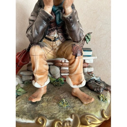 234 - NAO figurine of a seated tramp.

This lot is available for in-house shipping