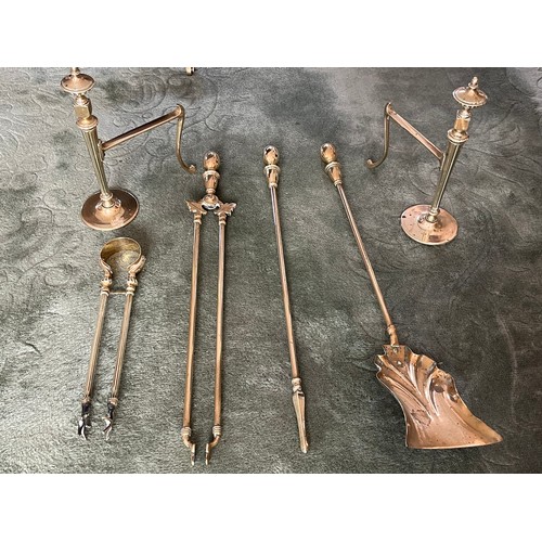 237 - Collection of polished brass fire side tools and fire dogs.

This lot is available for in-house ship... 