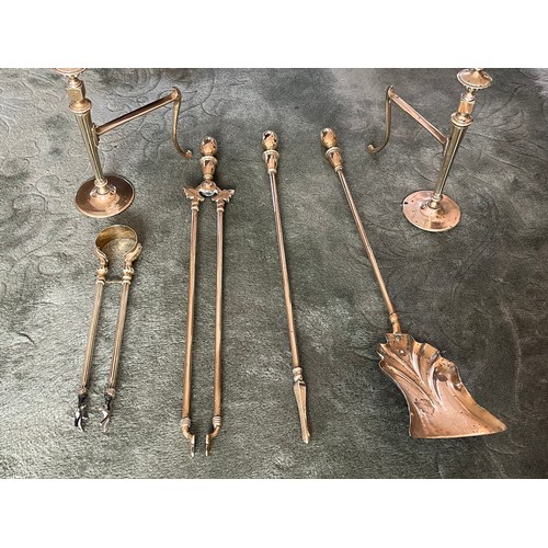 237 - Collection of polished brass fire side tools and fire dogs.

This lot is available for in-house ship... 