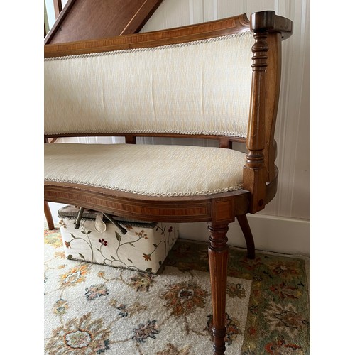 241 - Furniture, an upholstered kidney shaped Edwardian hall seat with inlaid decoration.

This lot is col... 