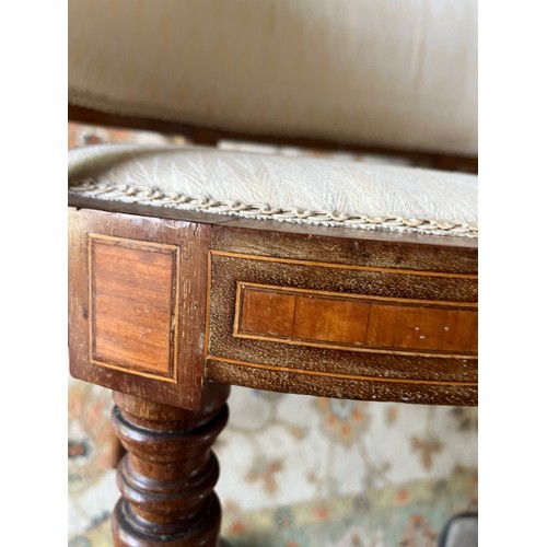 241 - Furniture, an upholstered kidney shaped Edwardian hall seat with inlaid decoration.

This lot is col... 