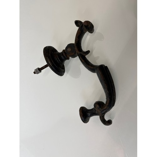 363 - Large cast iron doorknocker, 8 ½ inches long

This lot is available for in-house shipping