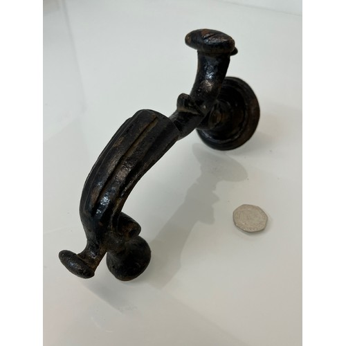 363 - Large cast iron doorknocker, 8 ½ inches long

This lot is available for in-house shipping