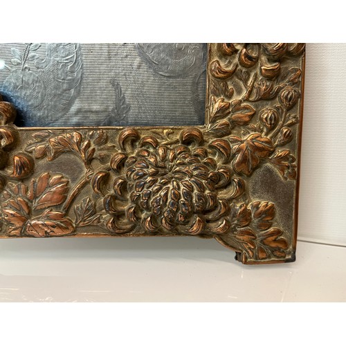 367 - Two Oriental plated copper picture frames embossed with dragons and flowers.

This lot is available ... 