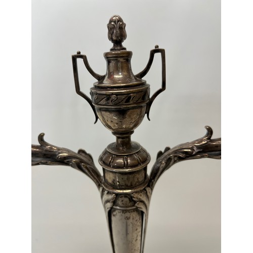 370 - Two branch candelabra of classical design, 11 inches high.

This lot is available for in-house shipp... 