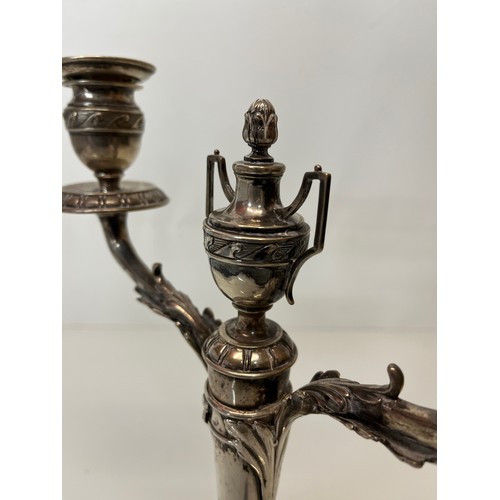 370 - Two branch candelabra of classical design, 11 inches high.

This lot is available for in-house shipp... 