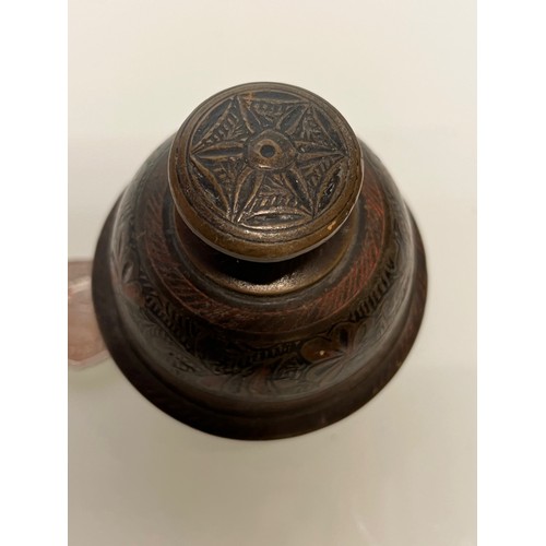 373 - Tibetan temple hand bell. Cast bronze with enamelled decoration. 

This lot is available for in-hous... 