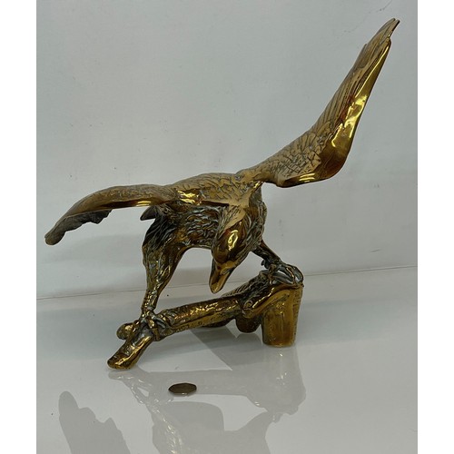 443 - A cast brass figure of an American Eagle of significant proportions 34 cm high and with a wing span ... 