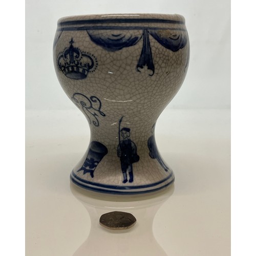 446 - A decorative crackle glazed vase with illustrations of fisherman around the base above these are a m... 