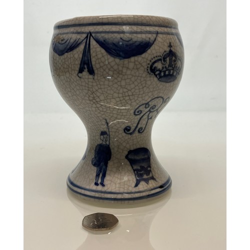 446 - A decorative crackle glazed vase with illustrations of fisherman around the base above these are a m... 