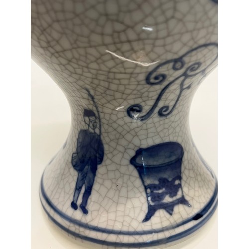 446 - A decorative crackle glazed vase with illustrations of fisherman around the base above these are a m... 