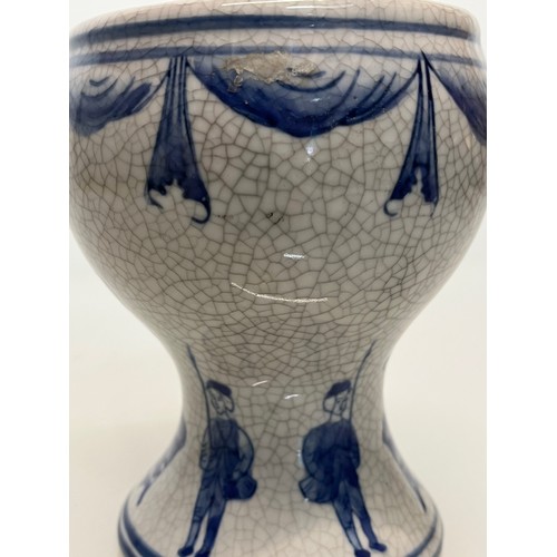 446 - A decorative crackle glazed vase with illustrations of fisherman around the base above these are a m... 