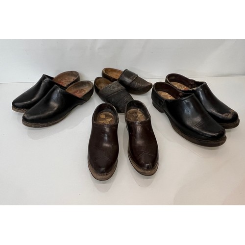 146 - A collection of early C20th working shoes, wooden soled clogs for all members of a family.

This lot... 