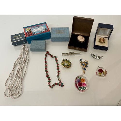 152 - Collection of costume jewellery, Lucite broach, cameos etc.

This lot is available for in-house ship... 