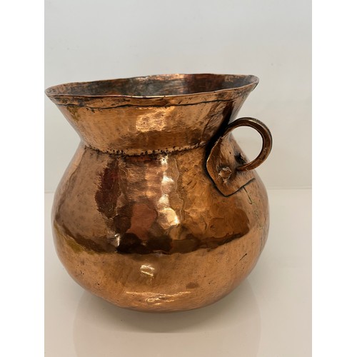 157 - Decorative hand made art nouveau copper two handled pot. 20 cm high

This lot is available for in-ho... 