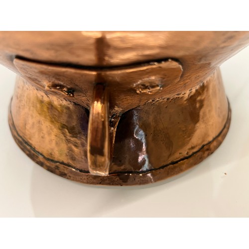 157 - Decorative hand made art nouveau copper two handled pot. 20 cm high

This lot is available for in-ho... 